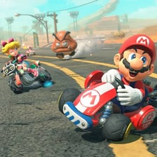Characters racing on a colorful Mario Kart track