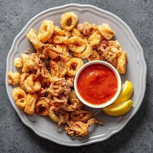 A plate of fried calamari rings.