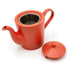 A teapot shown with its projecting pouring spout.