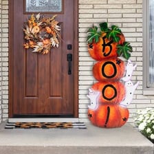 Orange pumpkins and black decorations arranged for Halloween
