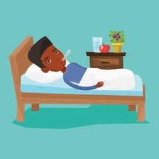 Sick person resting in bed with a thermometer