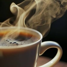 A steaming cup of coffee giving off a pleasant aroma.