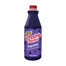 A purple grape-flavored drink in a glass
