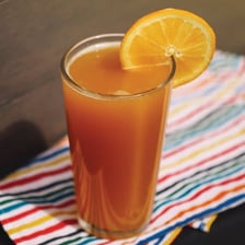 A brunch cocktail made with beer and orange juice