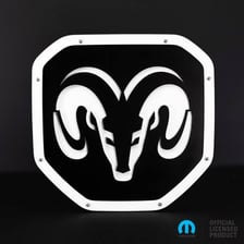 A Ram pickup truck displaying the brand’s ram-head logo.