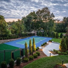 A pickleball court located near houses