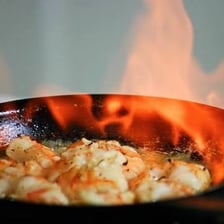 Food being scorched by high heat in a pan