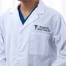 A group of doctors wearing hospital coats.
