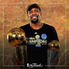 A victorious person holding a championship trophy