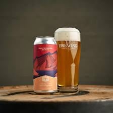 A pint of India pale ale with a foamy head.