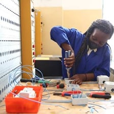 A person uses a practical skill while completing a task.