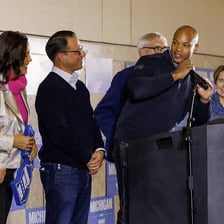 A campaign worker assisting at a political event.