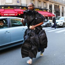 A stylish person whose clothing reflects a leading fashion trend.