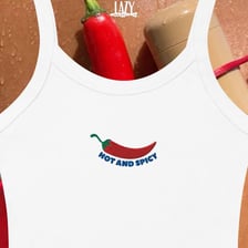 A fashionable outfit beside hot chili peppers.