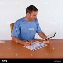 A person looking at a calendar to confirm availability.