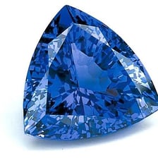 A polished gemstone displayed as a valuable object