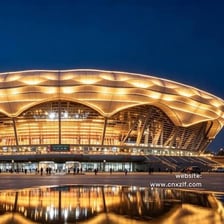 A large sports arena with a domed roof.
