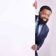 A person carefully peeking around a corner