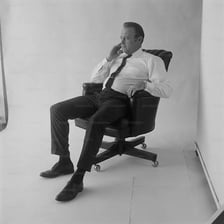 A person seated in a chair.