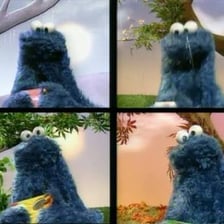 Cookie Monster eating cookies in a Sesame Street scene