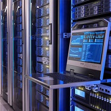 A technology workplace with servers and computer screens