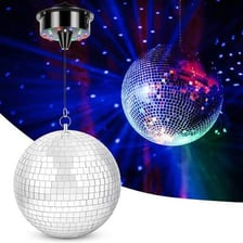 A mirrored disco ball rotating and scattering reflected light.