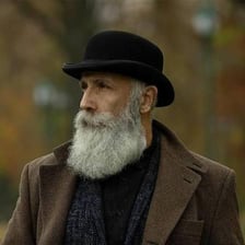 A bowler hat and a fedora shown side by side