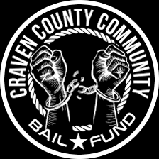Community members gathered outside a courthouse in support of people facing pretrial detention.