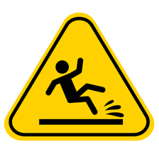 A person losing footing on a wet floor.