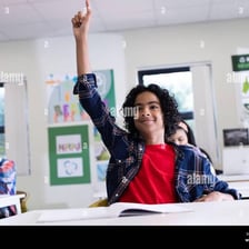 An enthusiastic person eagerly raising a hand.