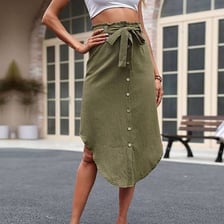 A person wearing a skirt that reaches approximately mid-calf.