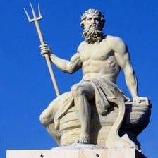 A statue of Neptune holding a trident.