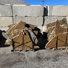 Several large, thick stone slabs stacked together.
