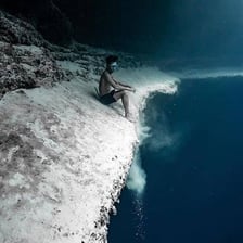 A diver entering deep water.