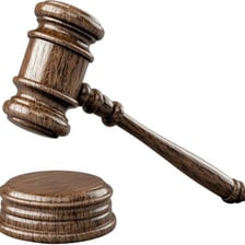 A judge presiding over a courtroom with a gavel visible.