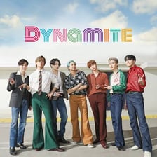 BTS performing in a scene associated with the “Dynamite” music video.