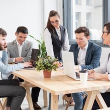 A person leading a committee meeting.