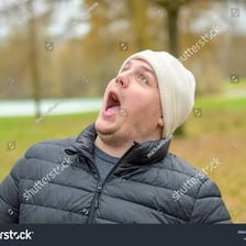 A person looking astonished with an open mouth