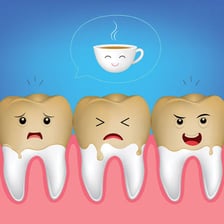 A cup of black tea shown beside an illustration of tooth staining.
