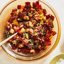 A plate of spicy Chongqing chicken with dried red chilies.