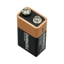 A rectangular nine-volt battery with two terminals on top