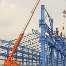 Workers building a structural frame.