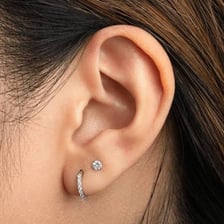 A small earring worn in an earlobe.