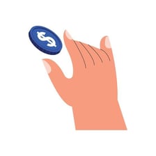 A hand tossing a coin above a surface