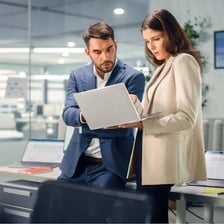An executive assistant working at a desk in an office
