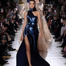 Fashion designer Elie Saab presenting a couture gown