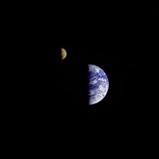 The Moon visible against the dark background of space
