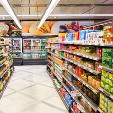 An aisle stocked with food in a grocery store