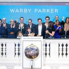 Company representatives celebrating a stock-market initial public offering.