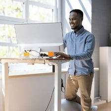 A person focused on continuing work at a desk.